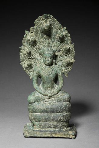 Crowned and bejeweled naga-enthroned Buddha