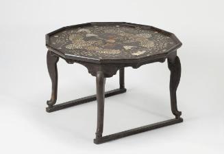 Table with phoenix motif