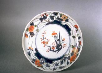 Lobed dish with iris and plum blossoms, one of a set of five