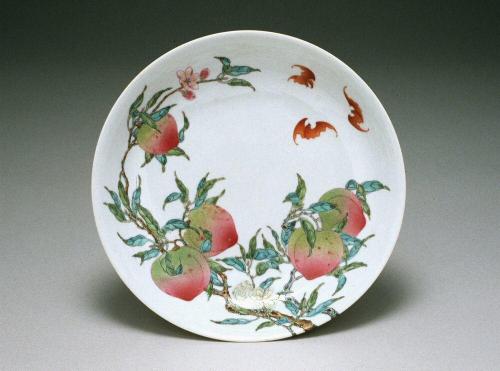 Plate with eight peaches and five bats, one of a pair