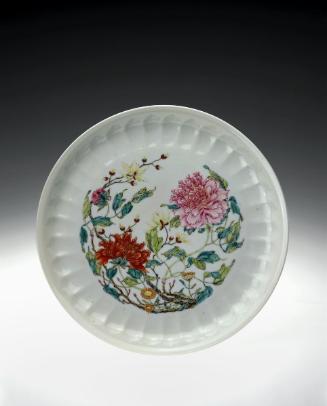 Plate decorated with magnolia and peonies, one of a pair