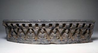 Fragment of a stupa with row of seated Buddhas