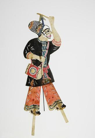 Male figure with black cap and carrying drum