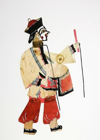 Male figure with black cap and carrying drum