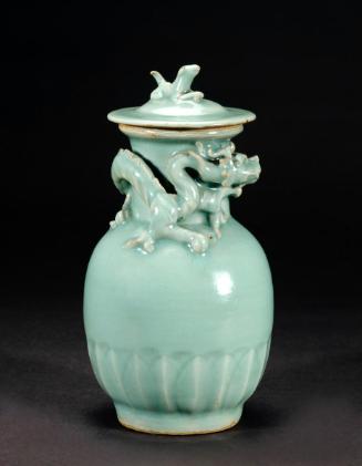 Lidded jar with applied dragon form and finial in the shape of a tiger