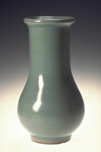 Vase with an elongated cylindrical neck and a dish-shaped mouth