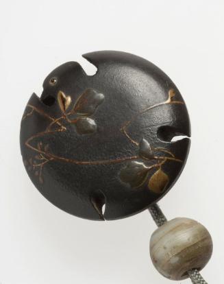 Netsuke in the shape of a sparrow with kudzu vines
