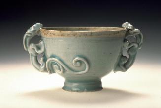 Bowl with dragon-shaped handles and design of lotus petals