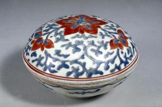 Container with design of floral scrolls