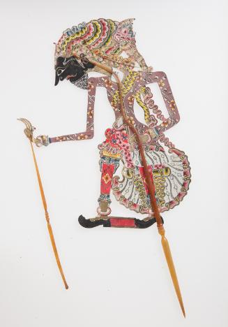 A god with turban, black face, pants and jacket, perhaps Jamadagni