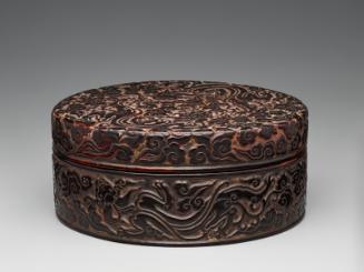 Round box with design of dragons playing amid clouds