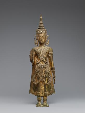 Standing crowned and bejewelled Buddha