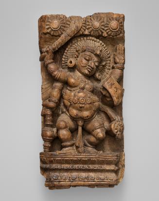 Four-armed attendant of the Hindu deity Shiva (gana) dancing