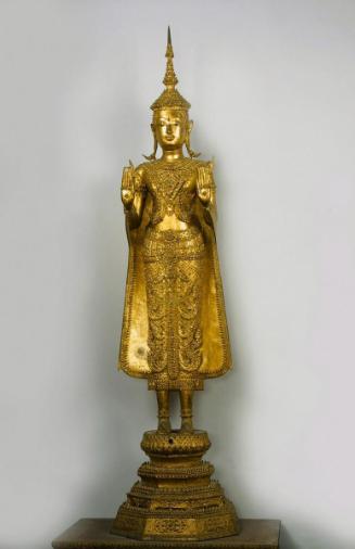 Standing crowned and bejeweled Buddha
