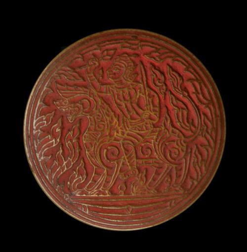 Seal with a male figure wearing a diadem riding a lion and holding a sword and a lotus