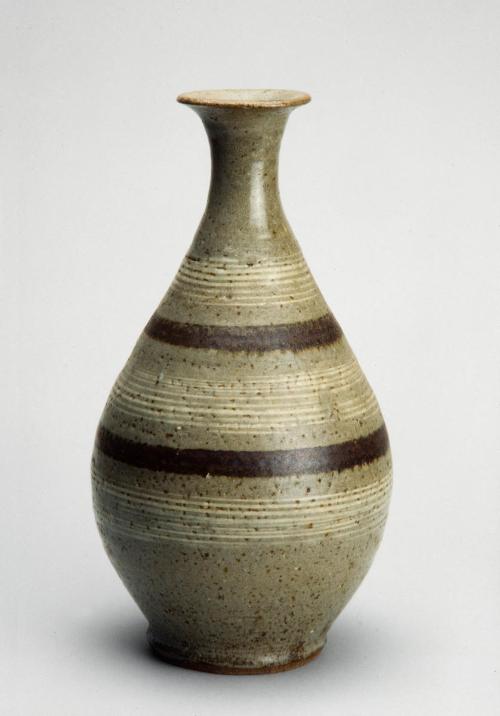 Elongated oval bottle with rope designs