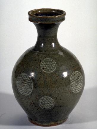 Bottle with round body and circle designs