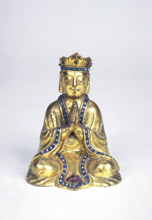 Seated worshipper, one of a pair