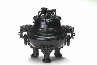 Incense burner with dragon-headed handles