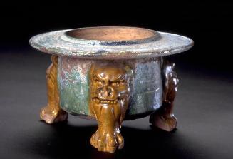 Incense-burner with molded animal-mask legs