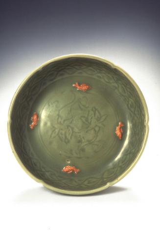 Dish with carved lotus branches and applied fish