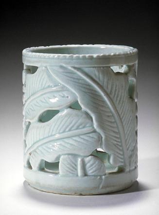 Brush container with leaf design