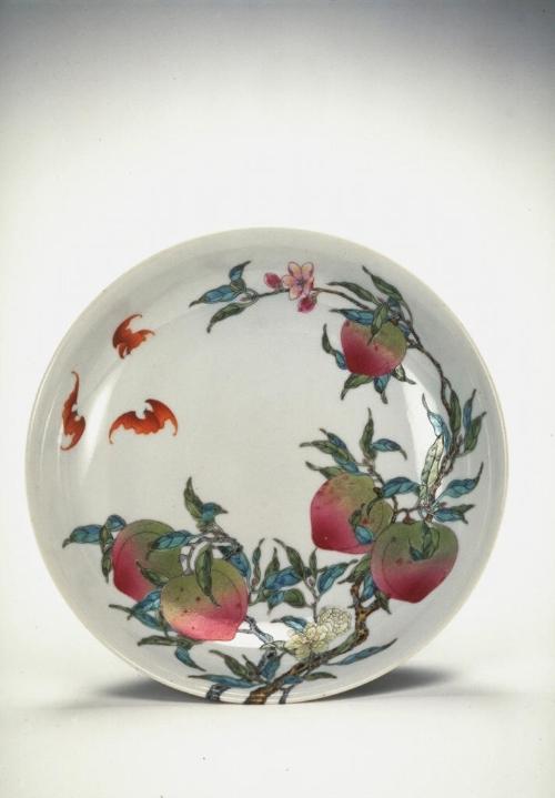 Plate with peaches and bats, one of a pair