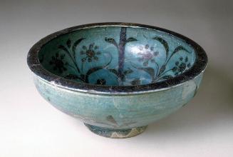 Deep bowl with floral decorations