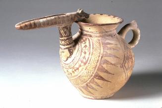 Beak-spouted jug with handle