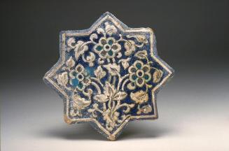 Tile with floral decoration