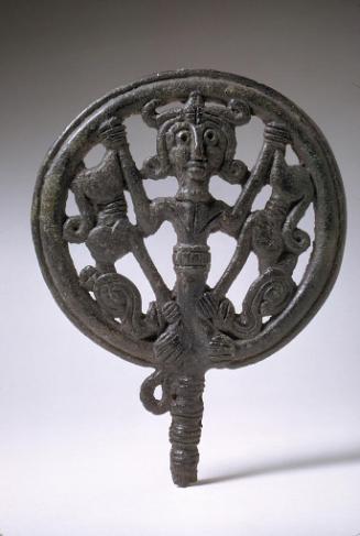 Round openwork pin head representing a Master of Animals