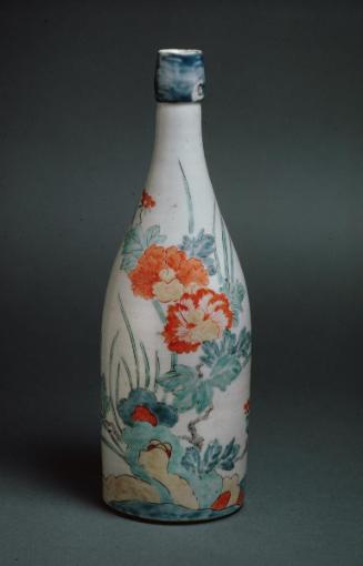 Bottle with peonies and rocks