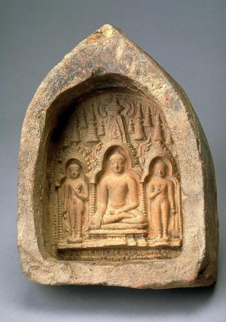 Votive tablet with seated Buddha flanked by standing Buddhas