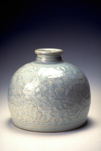 Vase with design of flower scrolls over waves