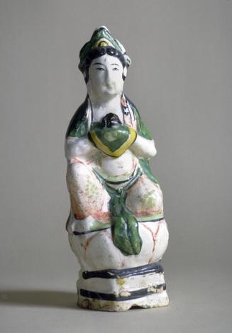 Bodhisattva sitting on a lotus throne, one of a pair