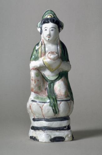 Bodhisattva sitting on a lotus throne, one of a pair