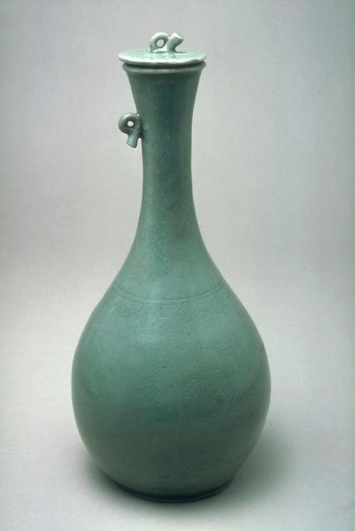 Lidded bottle with lotus design