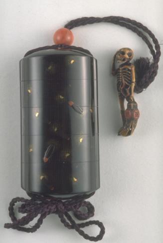 Netsuke of skeleton holding lantern