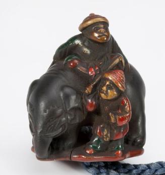 Netsuke of elephant with monkey handlers