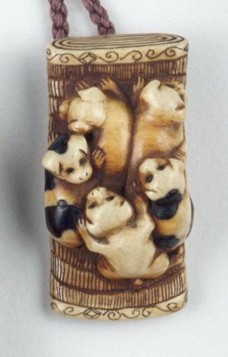 Puppies on a rolled mat