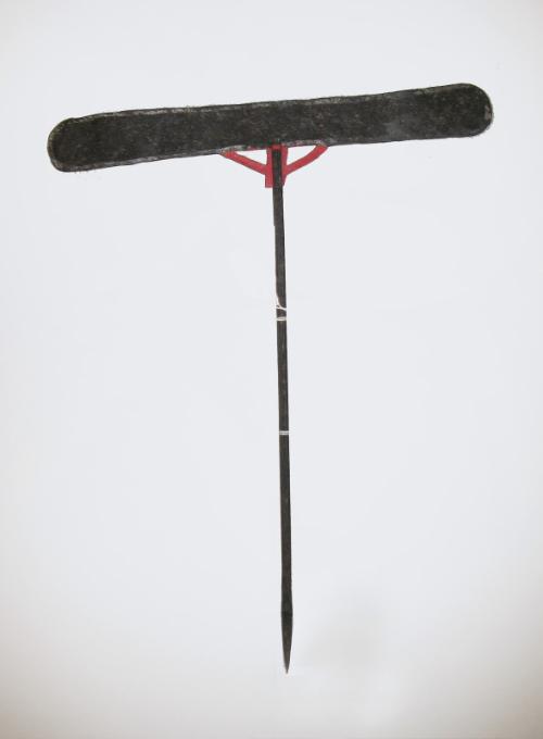 A prop (black stick)