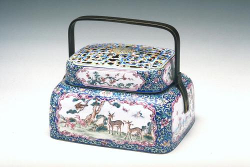 Handwarmer with deer, cranes, and pine trees