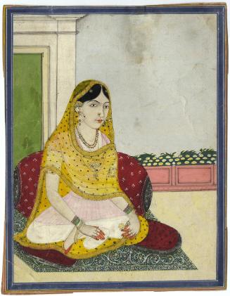 Seated woman with hennaed feet and hands