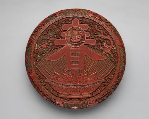 Circular box decorated with the character for spring and a bowl of treasures