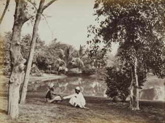 A Hindu and Muslim seated in a garden