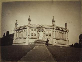 Officer posing in front of memorial well, Kanpur