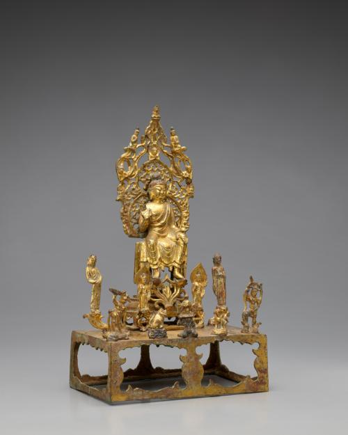 A buddha, probably Maitreya, flanked by bodhisattvas and attendants