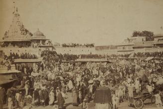 Great crowd of females sitting on the tops of houses on sun procession