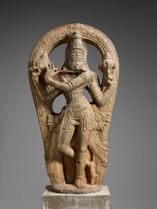 The Hindu deity Krishna playing the flute