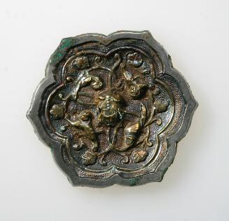 Gilded six-lobed mirror with vines, birds, and beasts